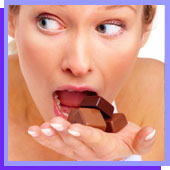 woman binging on chocolate